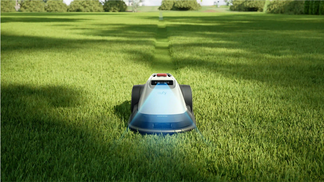 eufy Robot Lawn Mower E15 with AI vision sensor mowing neatly trimmed green grass in residential yard