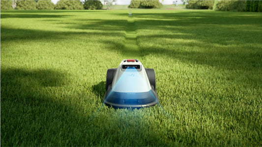 eufy Robot Lawn Mower E15 with AI vision sensor mowing neatly trimmed green grass in residential yard