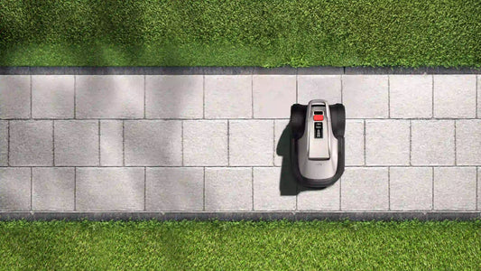 op view eufy E15 robot lawn mower on stone walkway